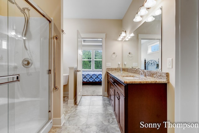 3912 Preserve Dr NE Unit 44, Belmont, MI 49306 - ensuite bathroom with double vanity, a stall shower, toilet, and baseboards