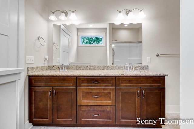 3912 Preserve Dr NE Unit 44, Belmont, MI 49306 - full bath with double vanity, a shower, and baseboards