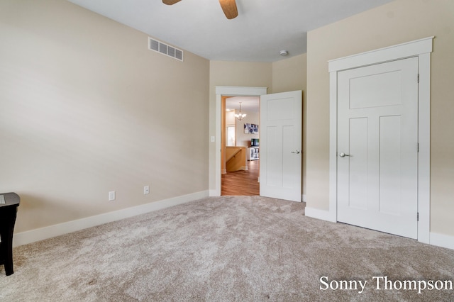 3912 Preserve Dr NE Unit 44, Belmont, MI 49306 - unfurnished bedroom with carpet floors, baseboards, a chandelier, and ceiling fan