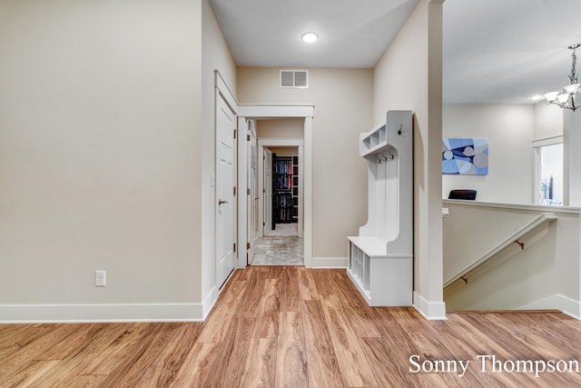 3912 Preserve Dr NE Unit 44, Belmont, MI 49306 - mudroom with baseboards, wood finished floors, and a chandelier