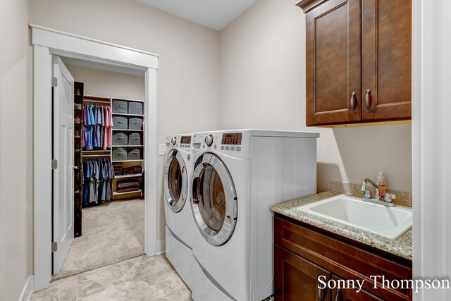 3912 Preserve Dr NE Unit 44, Belmont, MI 49306 - washroom featuring washing machine and dryer, cabinet space, and light colored carpet