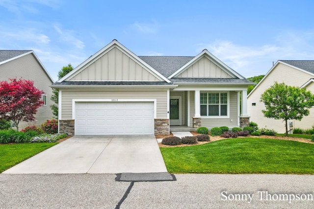 3912 Preserve Dr NE Unit 44, Belmont, MI 49306 - craftsman-style home with board and batten siding, stone siding, an attached garage, driveway, and a front lawn