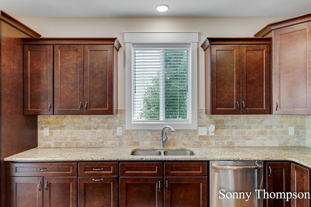 3912 Preserve Dr NE Unit 44, Belmont, MI 49306 - kitchen featuring dishwasher, a sink, decorative backsplash, and plenty of natural light