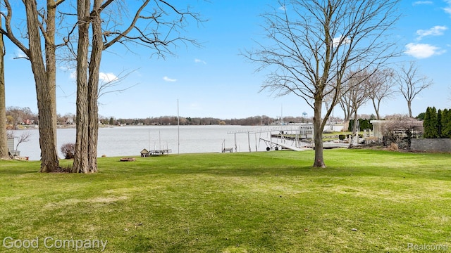 3501 Mann Rd, Clarkston, MI 48346 - view of green lawn featuring a boat dock and a water view