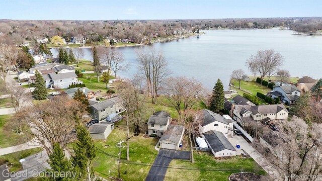 3501 Mann Rd, Clarkston, MI 48346 - aerial perspective of suburban area with a nearby body of water