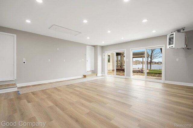 3501 Mann Rd, Clarkston, MI 48346 - unfurnished room featuring attic access, light wood-style flooring, recessed lighting, baseboards, and a heating unit