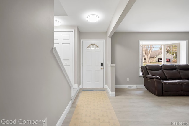 3501 Mann Rd, Clarkston, MI 48346 - entrance foyer with light wood-style floors and baseboards