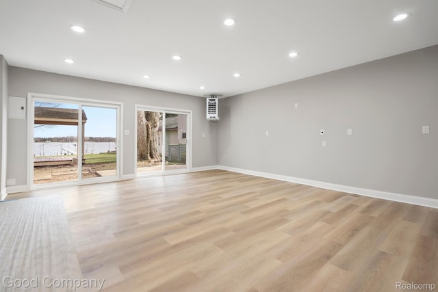 3501 Mann Rd, Clarkston, MI 48346 - spare room featuring recessed lighting, baseboards, and light wood-style flooring