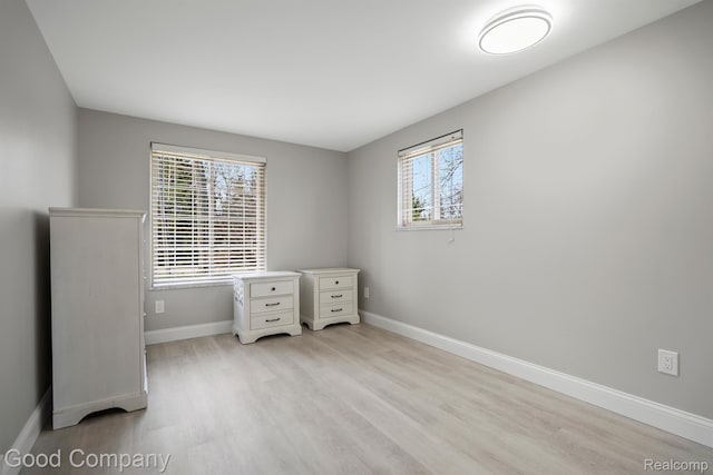 3501 Mann Rd, Clarkston, MI 48346 - unfurnished bedroom featuring light wood-style floors and baseboards