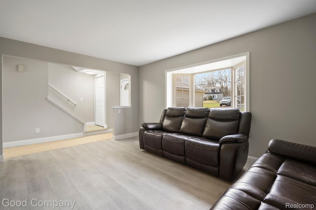 3501 Mann Rd, Clarkston, MI 48346 - living room with stairway, wood finished floors, and baseboards