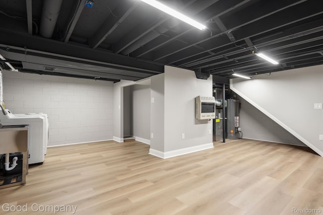 3501 Mann Rd, Clarkston, MI 48346 - finished below grade area with gas water heater, light wood-type flooring, heating unit, and baseboards