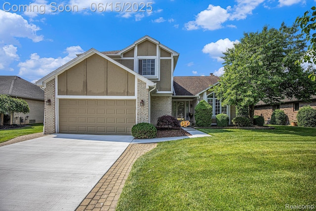16096 Violet Dr, Macomb, MI 48042 - view of front of property featuring brick siding, a front yard, driveway, and an attached garage