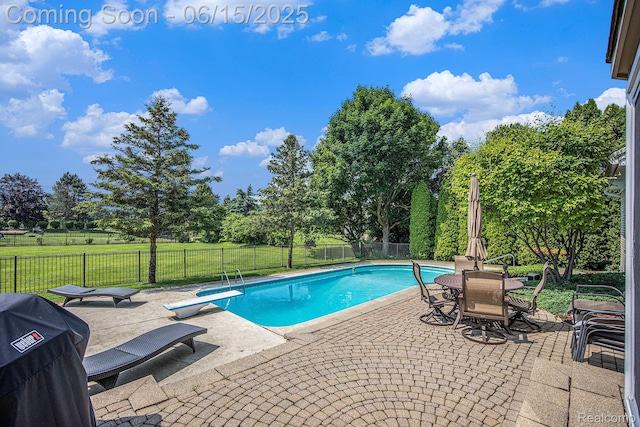 16096 Violet Dr, Macomb, MI 48042 - view of swimming pool with a patio area, grilling area, view of wooded area, and a diving board