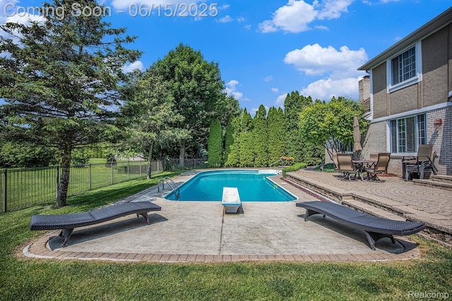16096 Violet Dr, Macomb, MI 48042 - view of swimming pool with a diving board, a patio, and a fenced backyard