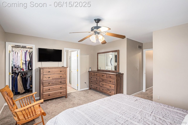 16096 Violet Dr, Macomb, MI 48042 - bedroom featuring light carpet, a walk in closet, a closet, and ceiling fan