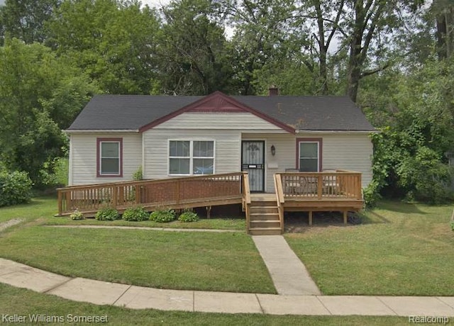 15861 Knight, Redford, MI 48239 - view of front of property with a wooden deck, a front lawn, and view of wooded area