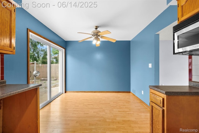 23312 Shoreview St, Saint Clair Shores, MI 48082 - unfurnished living room featuring ceiling fan and light wood finished floors