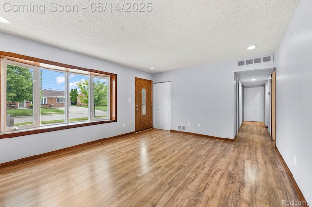 23312 Shoreview St, Saint Clair Shores, MI 48082 - unfurnished room featuring a textured ceiling, light wood-type flooring, and recessed lighting