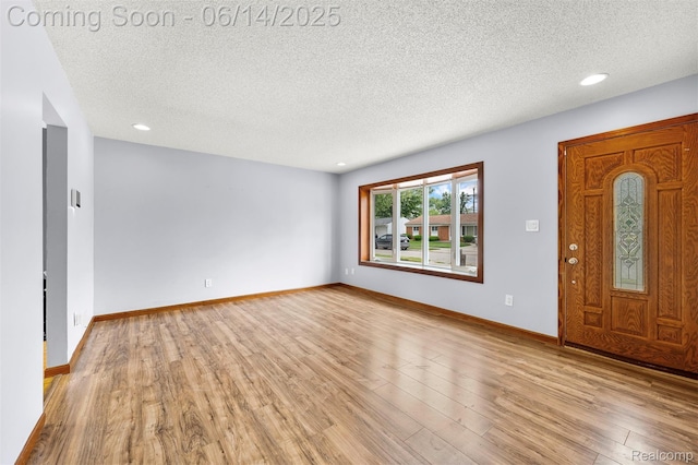 23312 Shoreview St, Saint Clair Shores, MI 48082 - entrance foyer with a textured ceiling, light wood-style flooring, and recessed lighting