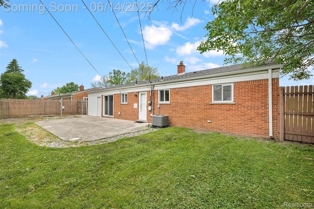 23312 Shoreview St, Saint Clair Shores, MI 48082 - rear view of house featuring brick siding, a patio, a chimney, and a fenced backyard