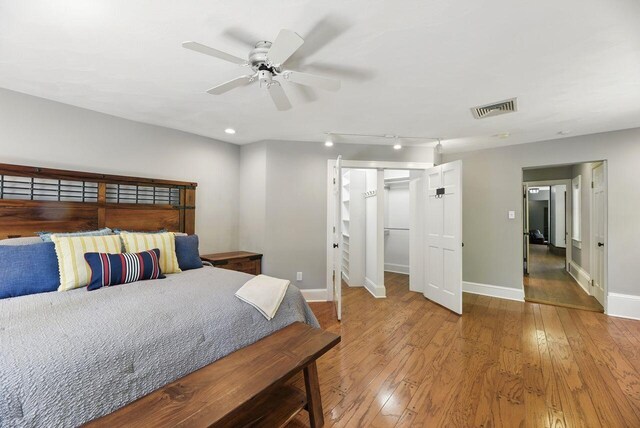 1630 S 3rd St, Niles, MI 49120 - bedroom featuring baseboards, hardwood / wood-style flooring, a ceiling fan, recessed lighting, and a walk in closet