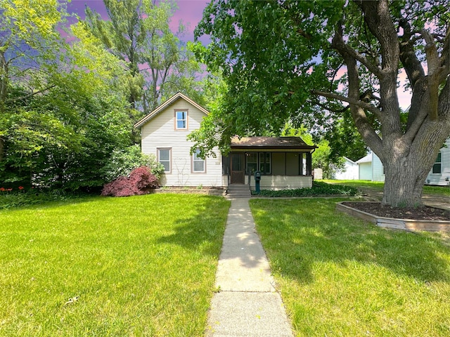 315 E Spruce St, Marshall, MI 49068 - view of front of property featuring a front lawn and a porch