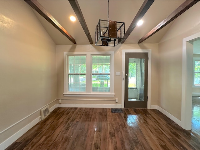 315 E Spruce St, Marshall, MI 49068 - entrance foyer with lofted ceiling, dark wood finished floors, baseboards, and a chandelier