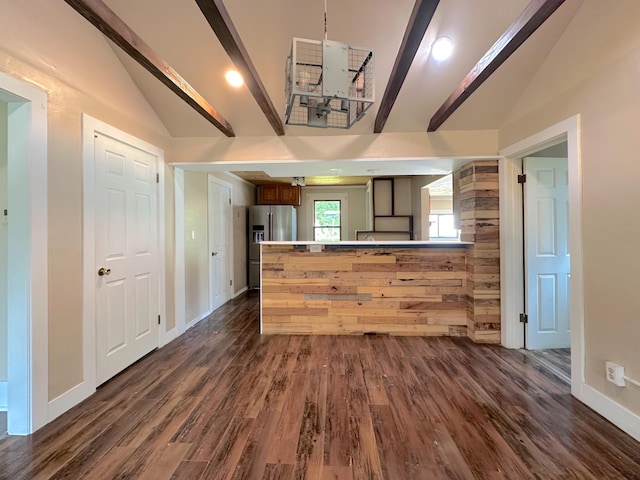 315 E Spruce St, Marshall, MI 49068 - kitchen featuring stainless steel refrigerator with ice dispenser, baseboards, dark wood finished floors, and a peninsula