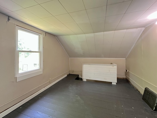 315 E Spruce St, Marshall, MI 49068 - additional living space with lofted ceiling, dark wood-type flooring, and baseboards