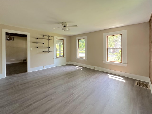 315 E Spruce St, Marshall, MI 49068 - spare room with ceiling fan, baseboards, and wood finished floors