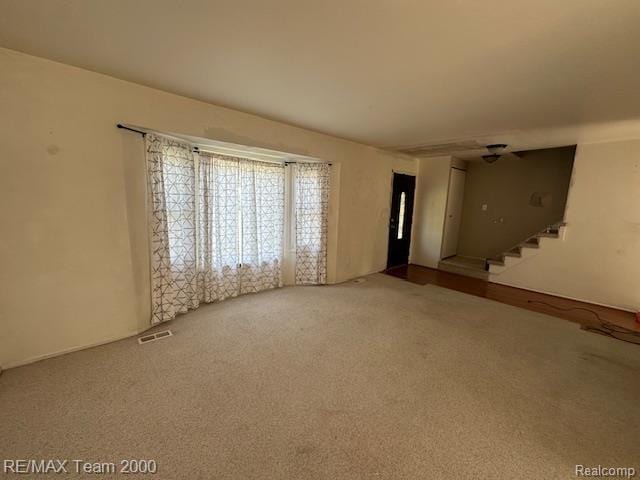 5936 Meadowview St, Ypsilanti, MI 48197 - spare room featuring stairs and carpet floors