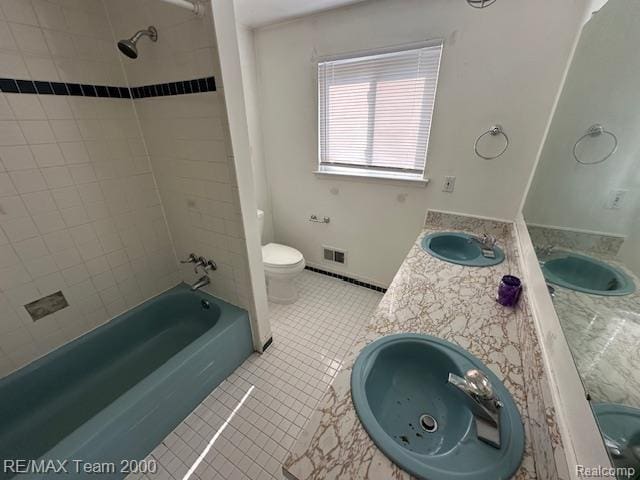 5936 Meadowview St, Ypsilanti, MI 48197 - bathroom featuring toilet, tile patterned flooring, shower / washtub combination, and double vanity