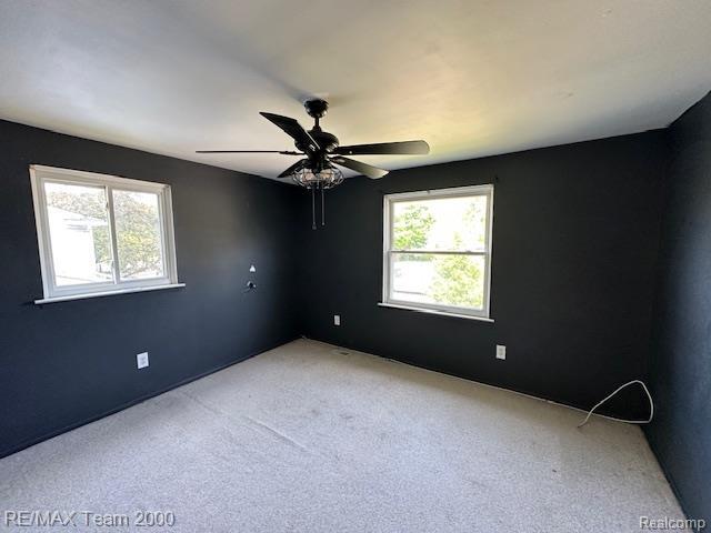 5936 Meadowview St, Ypsilanti, MI 48197 - unfurnished room with plenty of natural light, light carpet, and ceiling fan