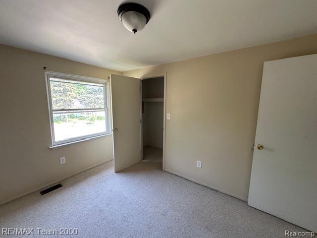 5936 Meadowview St, Ypsilanti, MI 48197 - unfurnished bedroom featuring light colored carpet and a closet