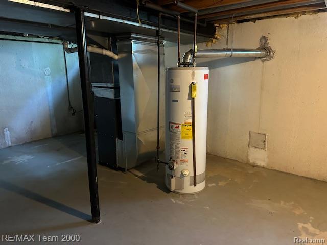 5936 Meadowview St, Ypsilanti, MI 48197 - unfinished basement featuring water heater