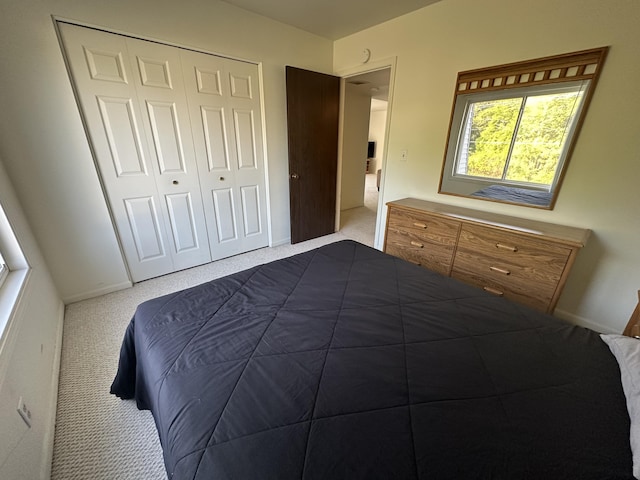 3626 Lakeshore Dr Unit K10, Saint Joseph, MI 49085 - bedroom with dark colored carpet, a closet, and baseboards