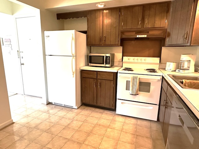 3626 Lakeshore Dr Unit K10, Saint Joseph, MI 49085 - kitchen with appliances with stainless steel finishes, under cabinet range hood, light countertops, and a sink