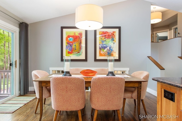 3348 Clearview Ln, Saugatuck, MI 49453 - dining area with wood finished floors, lofted ceiling, and baseboards