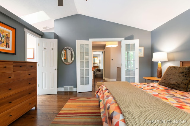 3348 Clearview Ln, Saugatuck, MI 49453 - bedroom with lofted ceiling, wood finished floors, a skylight, baseboards, and french doors