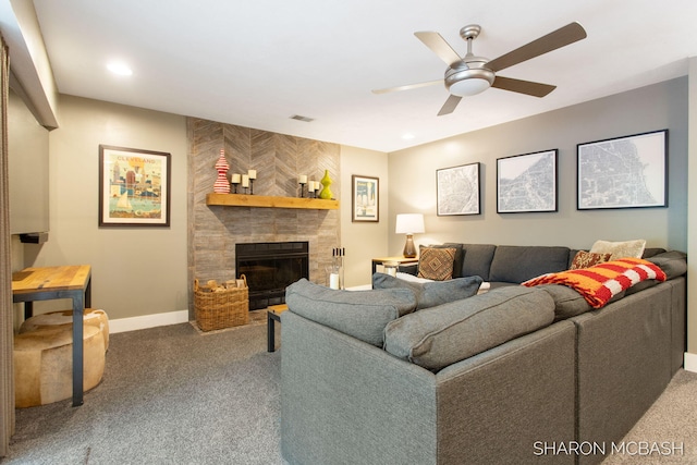 3348 Clearview Ln, Saugatuck, MI 49453 - carpeted living room with a ceiling fan, a tiled fireplace, and baseboards