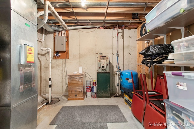 3348 Clearview Ln, Saugatuck, MI 49453 - unfinished below grade area with electric panel, a water pressure tank, and heating unit