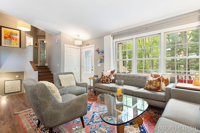 3348 Clearview Ln, Saugatuck, MI 49453 - living area with wood finished floors, plenty of natural light, lofted ceiling, and stairs