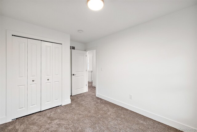 2813 Summers Pl, Troy, MI 48084 - unfurnished bedroom featuring carpet flooring, baseboards, and a closet