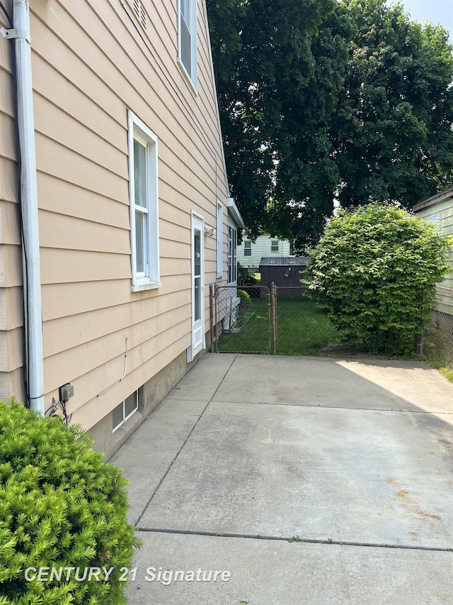1613 Waldman Ave, Flint, MI 48507 - view of property exterior featuring a patio area