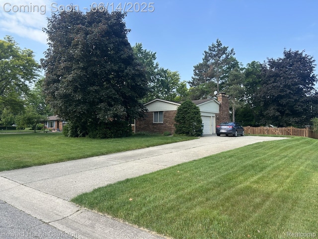 5045 Bronco Dr, Clarkston, MI 48346 - view of side of property featuring a garage, concrete driveway, a chimney, and brick siding