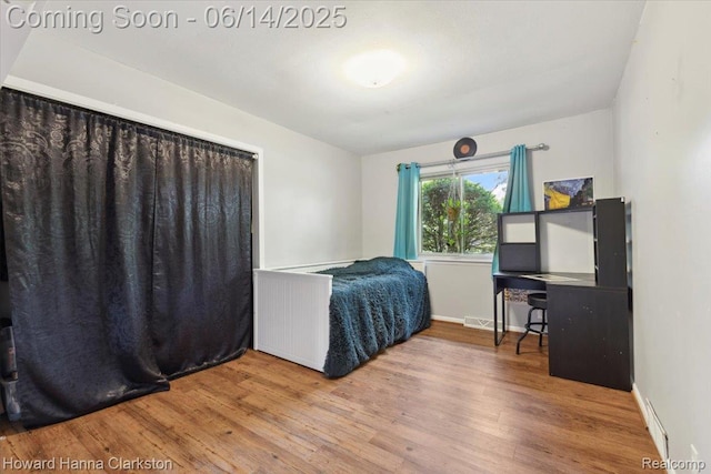 5045 Bronco Dr, Clarkston, MI 48346 - bedroom featuring wood finished floors and baseboards