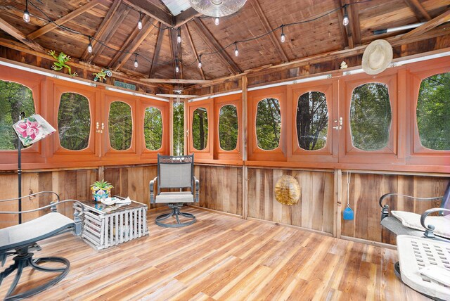 731 13 Mile Rd NW, Sparta, MI 49345 - living area with wooden ceiling, wood-type flooring, and wood walls