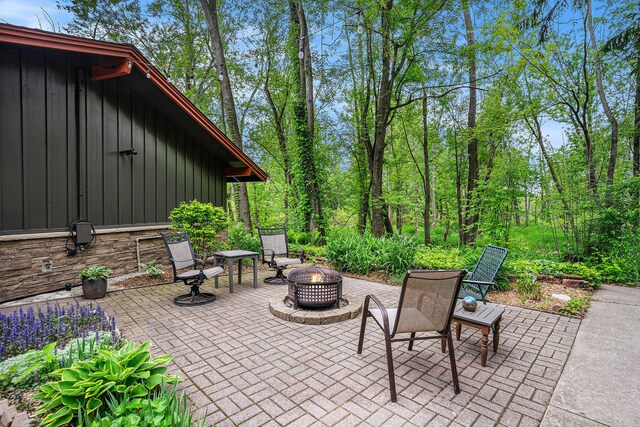 731 13 Mile Rd NW, Sparta, MI 49345 - view of patio / terrace with a fire pit