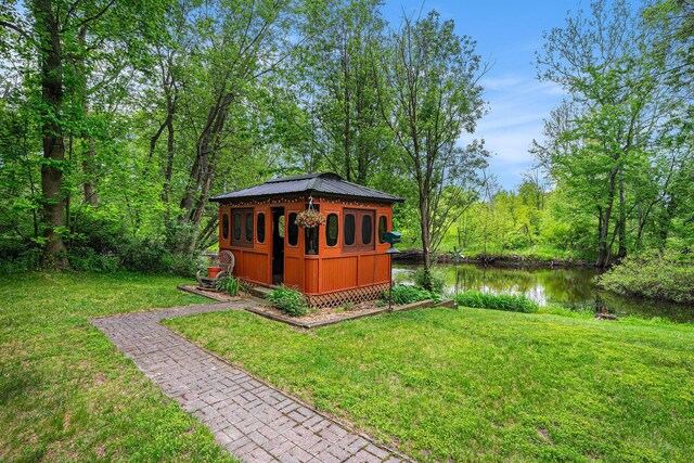 731 13 Mile Rd NW, Sparta, MI 49345 - view of outdoor structure featuring a water view