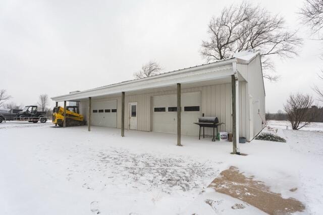 14656 Hersey Rd, Hersey, MI 49639 - snow covered garage featuring a garage